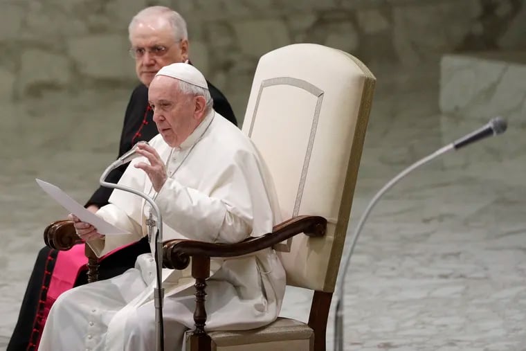 Pope Francis reads his message during the weekly general audience at the Vatican, Wednesday, Feb. 12, 2020, a week after his address for the Pontifical Academy of Social Sciences.