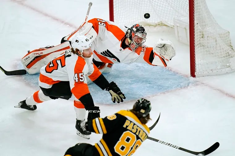 Boston Bruins right wing David Pastrnak shoots past Flyers goaltender Carter Hart for his second goal. Hart stopped 33 of 36 shots in defeat for the Flyers.