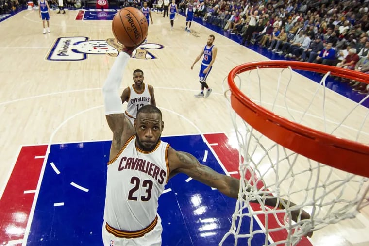 LeBron James dunks against the 76ers. Could he be scoring for them soon?