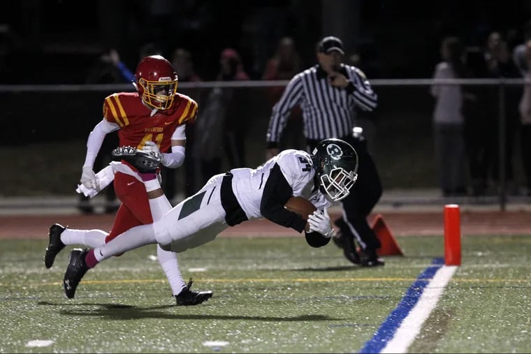 Ridley's Lamont Sudler (34) dives toward the end zone on a 29-yard, third quarter-reception against Haverford High.