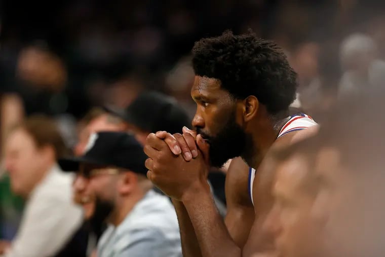 76ers center Joel Embiid sits on the bench late in the fourth quarter in Game 7 of the Eastern Conference semifinals against the Boston Celtics on May 14.
