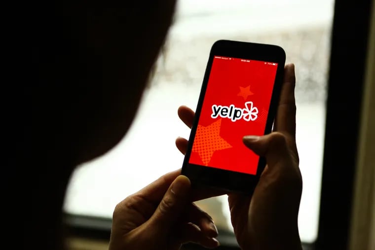 The Yelp application is displayed on a phone in an arranged photograph taken in New York on Feb. 5, 2016. Bloomberg photo by Chris Goodney.
