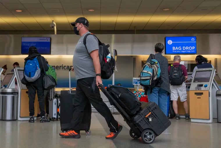 Travelers at Philadelphia International Airport Terminal C on Friday.