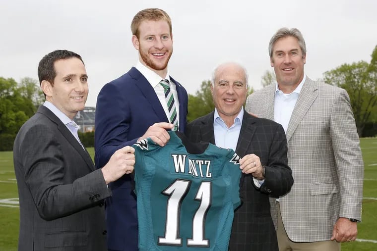 Five years ago, Howie Roseman (left) surrendered five draft picks and three players to move up and draft Carson Wentz.