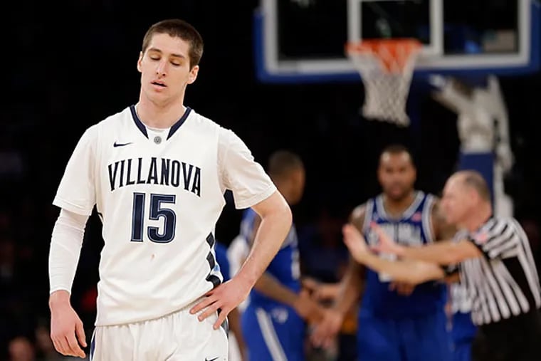 Villanova's Ryan Arcidiacono, left, reacts after his team committed a foul during the second half of an NCAA college basketball game against Seton Hall in the second round of the Big East Conference tournament at Madison Square Garden, Thursday, March 13, 2014 in New York. Seton Hall defeated Villanova 64-63. (Seth Wenig/AP)