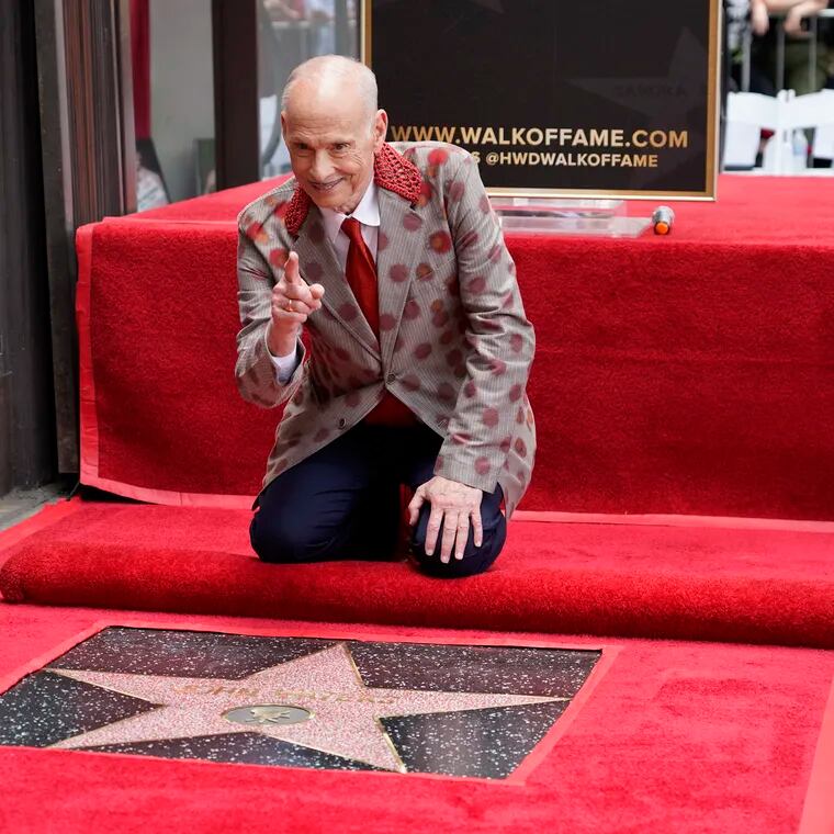 John Waters poses with his new star during a ceremony on the Hollywood Walk of Fame Sept. 18.