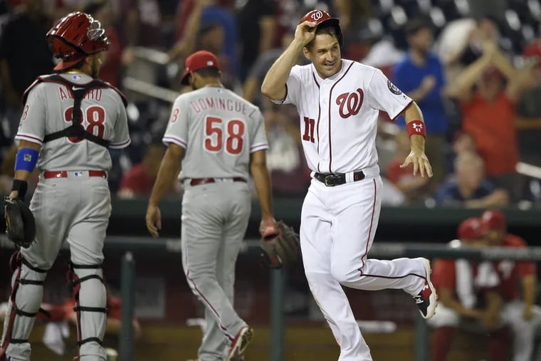 Nationals' first baseman Ryan Zimmerman heads home after hitting a walk-off homer agianst Seranthony Dominguez (center) on Wednesday.