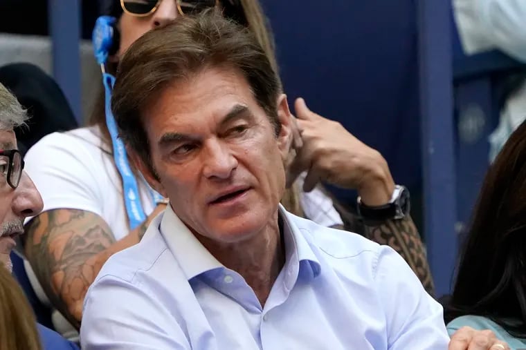Mehmet Oz watches play during the women's singles final of the U.S. Open tennis championships, in this file photo from last year. 
 Oz is running in the wide-open race for the Pennsylvania seat being vacated by two-term Republican Sen. Pat Toomey.