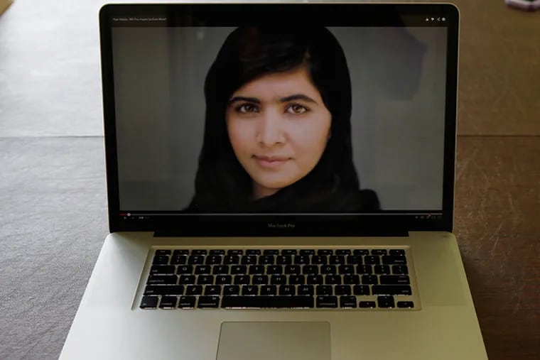 A photo of Malala Yousafzai appears in the video made by students at Mount Saint Joseph Academy in Flourtown, Pa. (MICHAEL S. WIRTZ/Staff Photographer)