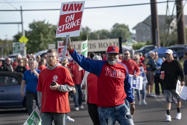 UAW Local 644 workers on strike march in a rally against the Dometic manufacturing company on Friday in Royersford. In Langhorne on Friday, a group of UAW workers joined thousands of others nationally in a strike against GM, Stellantis and Ford car companies.