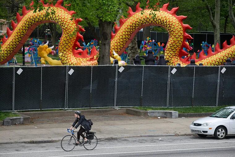 Franklin Square, a public park, is covered by tall fencing and tarps during the Chinese lantern festival. The public has to pay $17 to visit at night -- until June 12.