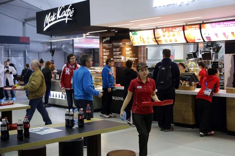 A McDonald's restaurant inside the Olympic Village dining hall at the 2014 Winter Games in Sochi, Russia. The partnership between the fast-food giant and IOC was to end in 2020.