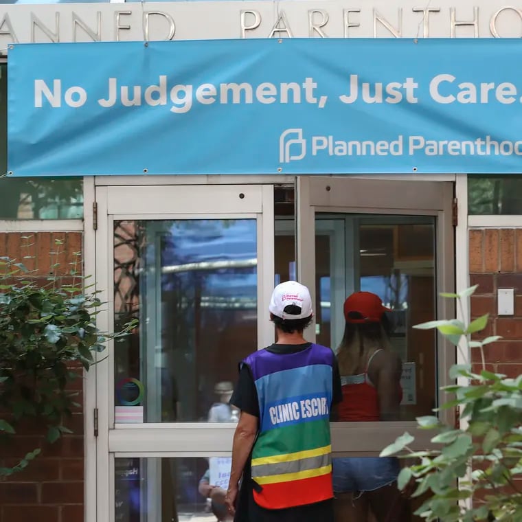 Bobbie Trotenberg, a patient escort, watched as a patient entered Planned Parenthood in Center City after she walked her to the door in Philadelphia on July 20.