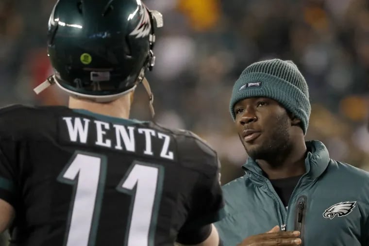Wide receiver Nelson Agholor talks with Carson Wentz while on the sideline of Monday night&#039;s game against the Packers.