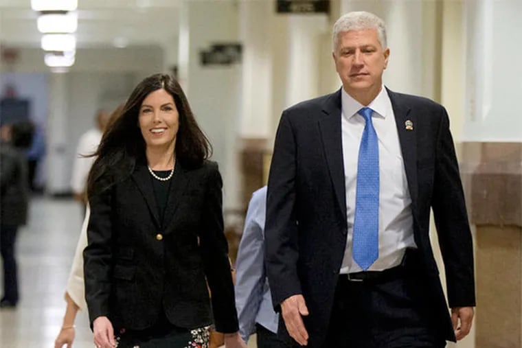 Attorney General Kathleen Kane with supervisory agent Louis C. DeTitto of her executive protection detail in March after a state Supreme Court hearing. DeTitto had served a 10-day suspension for sharing porn emails. Last month, Kane promoted him and gave him a raise.
