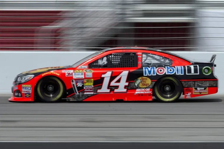 NASCAR driver Tony Stewart practices for Sunday's NASCAR auto race at Atlanta Motor Speedway in Hampton, Ga., Friday, Aug. 29, 2014. Sunday's race will be his first since his car struck and killed a fellow driver during a sprint race in New York three weeks ago. (AP Photo/John Bazemore)
