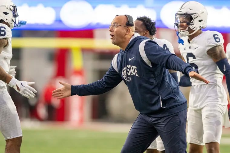 Penn State head coach James Franklin reacts with players after they scored during the second half of an NCAA college football game against Indiana, Saturday, Nov. 5, 2022, in Bloomington, Ind. (AP Photo/Doug McSchooler)