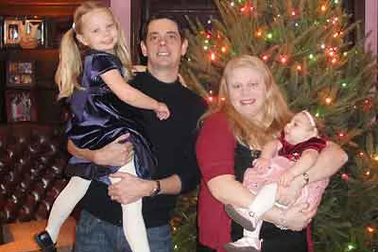 The parents of Anabelle Linzey (right), who has severe brain malformations and needs round-the-clock care, discovered that her Medicaid benefits had been cut without warning when a hospital ran her insurance card.