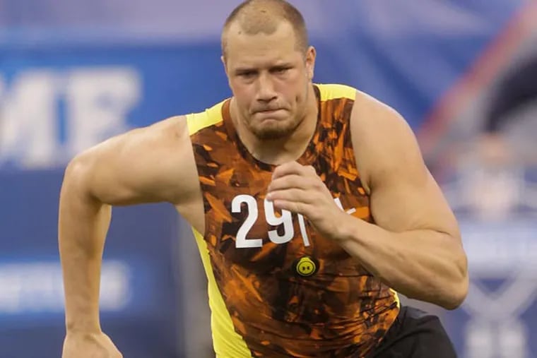 Lane Johnson runs a drill during the NFL football scouting combine in Indianapolis, Saturday, Feb. 23, 2013. (Dave Martin/AP file)