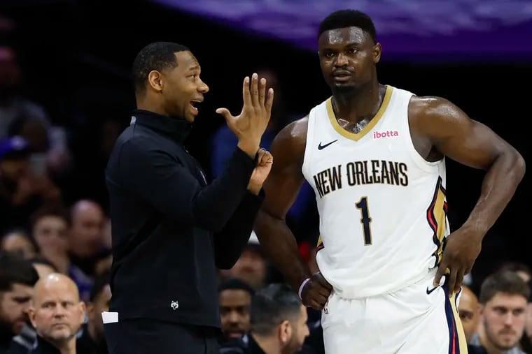 New Orleans Pelicans head coach Willie Green talks to forward Zion Williamson against the Sixers on Friday, March 8, 2024 in Philadelphia.