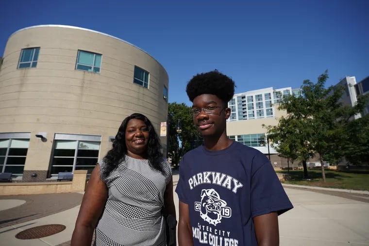 Parkway Center City Middle College (PCCMC) students Tanya Pressley, left, and her son Donald Pressley Jr., right, shown here on campus after a press conference to give information about Parkway Middle College HS, where students earn HS diplomas and associates degrees at CCP concurrently, at Philadelphia Community College, in Philadelphia, July 25, 2019.