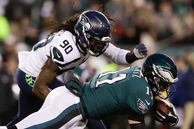 Seahawks defensive end Jadeveon Clowney dives into his now infamous hit on Carson Wentz during the first quarter of the Eagles' wild-card playoff game back in January.