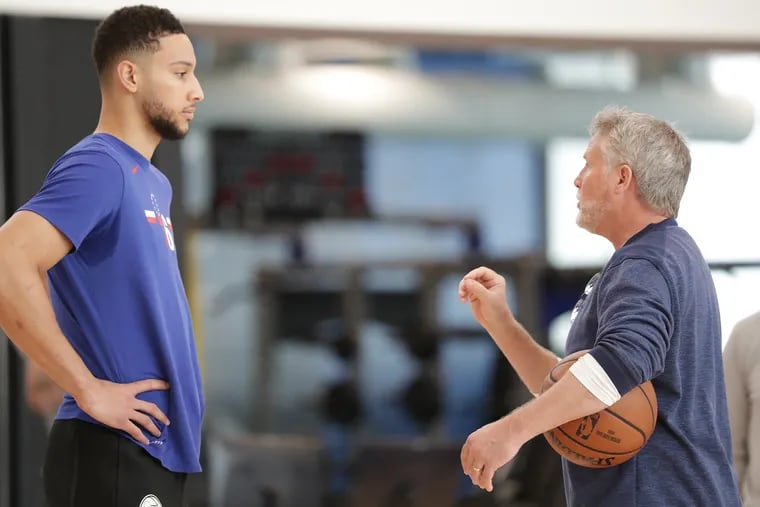 Sixers’ coach Brett Brown, talks with Ben Simmons at the Sixers' practice facility.