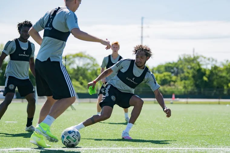 Philadelphia Union midfielder José Andrés Martínez (right) keeps the ball away from Jack Elliott (center) as Michee Ngalina (left) looks on during a training session at the 76ers' Fieldhouse complex in Wilmington, Delaware earlier this month.