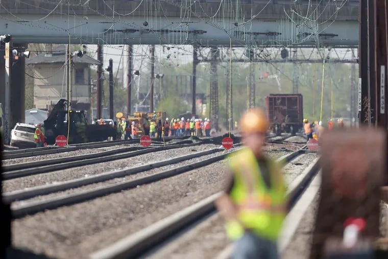 Crews work at the scene of a Norfolk Southern freight train derailment in Ridley Park, PA on May 3, 2018. The derailment affected trains on both the SEPTA Wilmington and Newark Regional Rail line.
