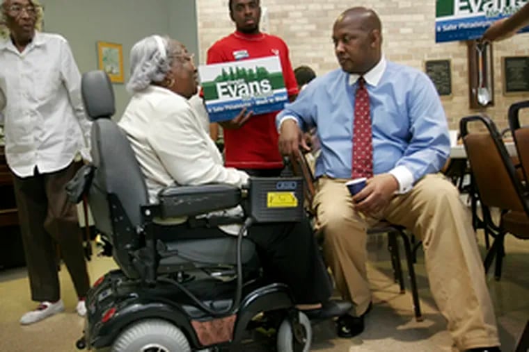 Mayoral candidate Dwight Evans talks with Margaret Burkett, a resident of the Scottish Rite Towers on Fitzwater Street, after he spoke with residents there.