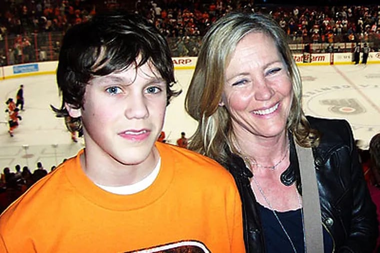 Kerstin Pietzsch-Somnell, the former fiancee of Pelle Lindbergh, with her son, Jens, at a Flyers game last March.