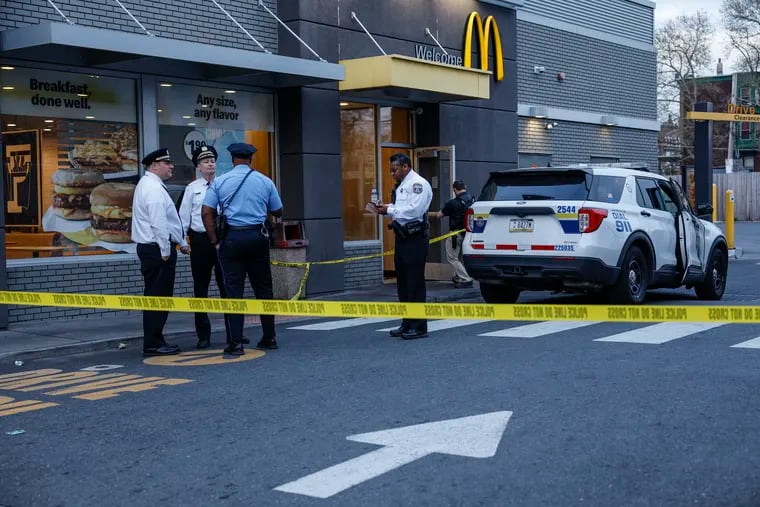Police on the scene at a McDonald's near Broad Street and Allegheny Avenue, where a 9-year-old girl was shot in the leg as she was about to enter the restaurant around 6:15 p.m. Wednesday, police said.