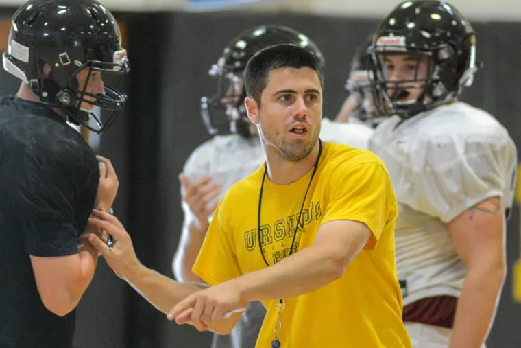 New Archbishop Wood head football coach Kyle Adkins gives directions to his players during a practice last week.