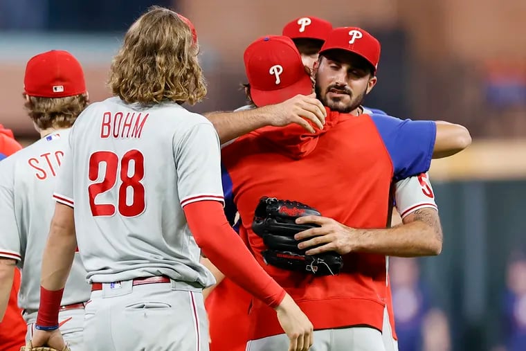Pitcher Zach Eflin embracing his teammates after the Phillies beat the Houston Astros and clinched a spot in the postseason on Monday.