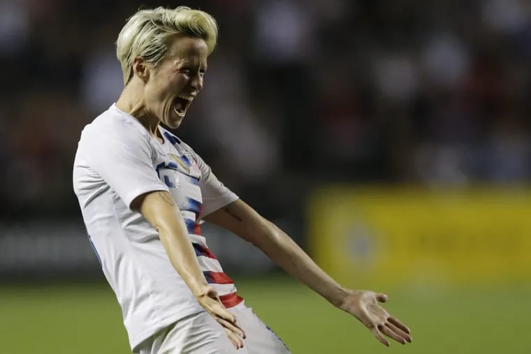 Megan Rapinoe scored two goals and helped set up three others in the U.S. women's soccer team's 6-0 rout of Mexico in World Cup qualifying.