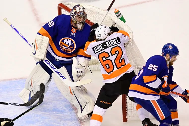 Flyers right winger Nicolas Aube-Kubel (62) knocks the net off its moorings as New York Islanders goaltender Semyon Varlamov (40) looks on during first-period of Game 6. The Flyers won in double overtime, 5-4, as Aube-Kubel had a key assist in the victory.