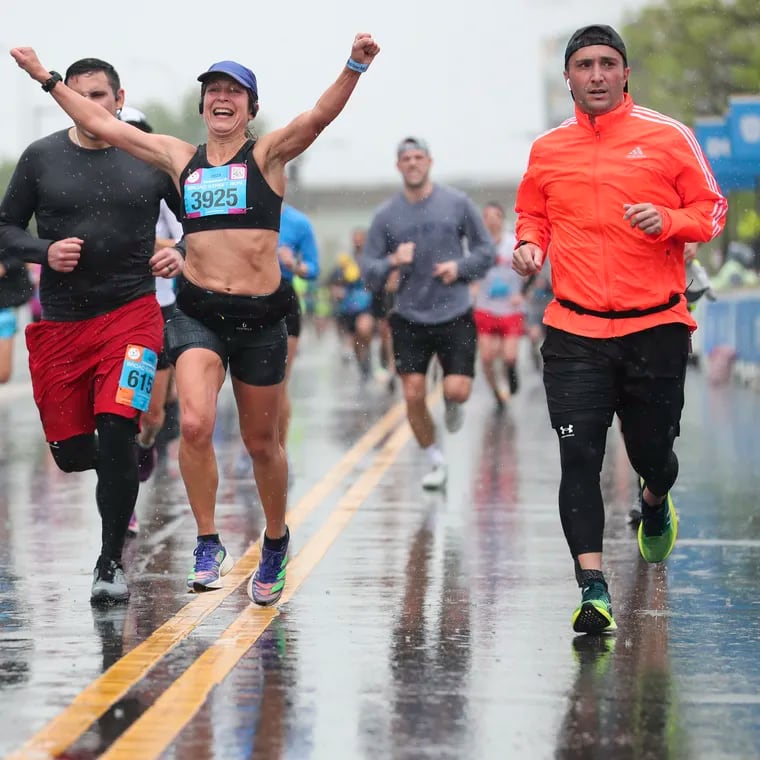 Runners approach the finish line in the Independence Blue Cross Broad Street Run on 11th Street in South Philadelphia, Pa. on Sunday, April 30, 2023.