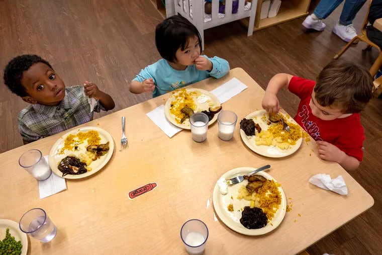 Three-year-old students start lunch at Children's Village last month. Chef Matt Ferry and head cook Stephanie Chisholm serve hundreds of fresh, cooked-from-scratch gourmet-worthy meals daily for some of life's most difficult critics — the pre-K set.