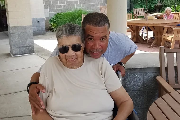 Lois Coleman entered St. Francis Center for Healthcare &  Rehabilitation in November 2014, just days after Charles-Edouard Gros bought the Darby facility. She died of alleged neglect  on Sept. 7. 2017, six days after the Pennsylvania Department of Health revoked St. Francis's license. She is shown here, with her son William Coleman, on the patio at St. Francis in June 2016.