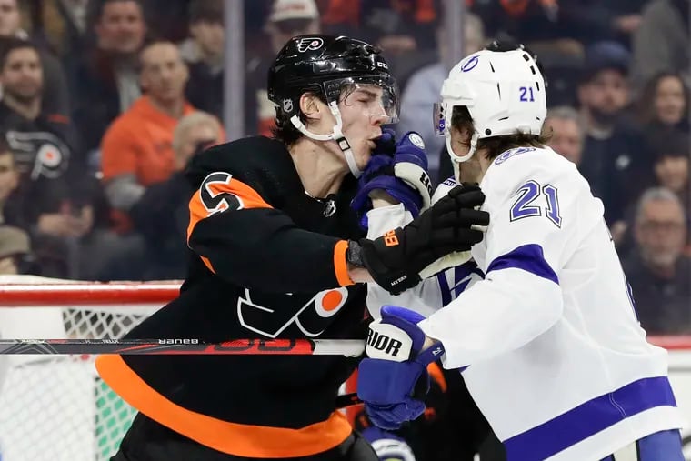 Flyers defenseman Phil Myers and Tampa Bay Lightning center Brayden Point shoving each other in the teams' Jan. 11 game at the Wells Fargo Center. Tampa prevailed, 1-0. The teams will have a rematch Saturday in Tampa.