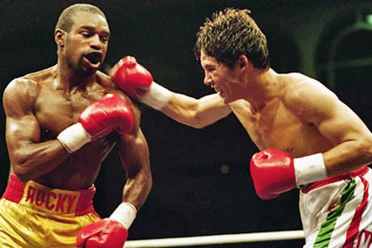 Junior Mexican lightweight world champion Julio Cesar Chavez delivers a right hook to Rocky Lockridge during their title fight Aug. 4, 1986, in Monaco. A year later, Lockridge became the International Boxing Federation's super featherweight champion. (AP Photo / Gilbert Tourte)