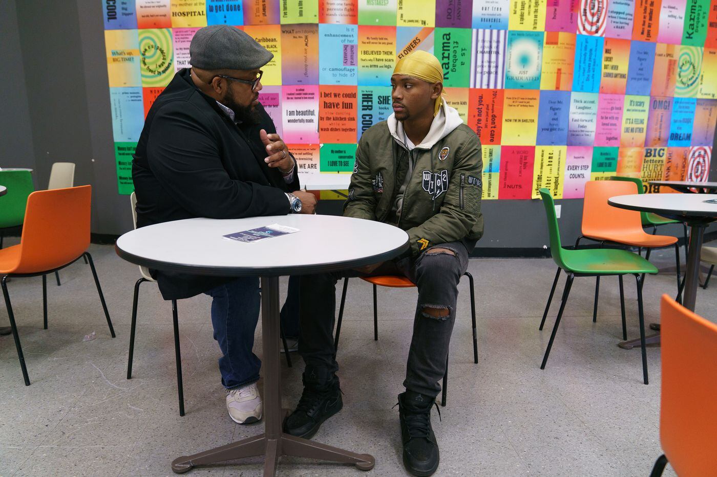 Abdul Malik (left), a credible messenger, works with Syir Simmons, a client at the South Bronx NeON. Malik planned to accompany Simmons to enroll in a school and job-training program that afternoon.