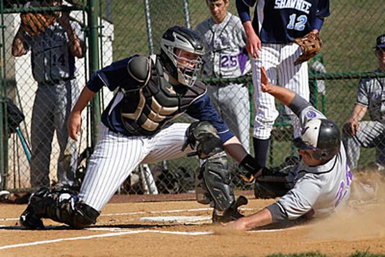 Cherry Hill West's Alex Injaian is tagged out at the plate, but the Lions came out on top. (Michael S. Wirtz/Staff Photographer)