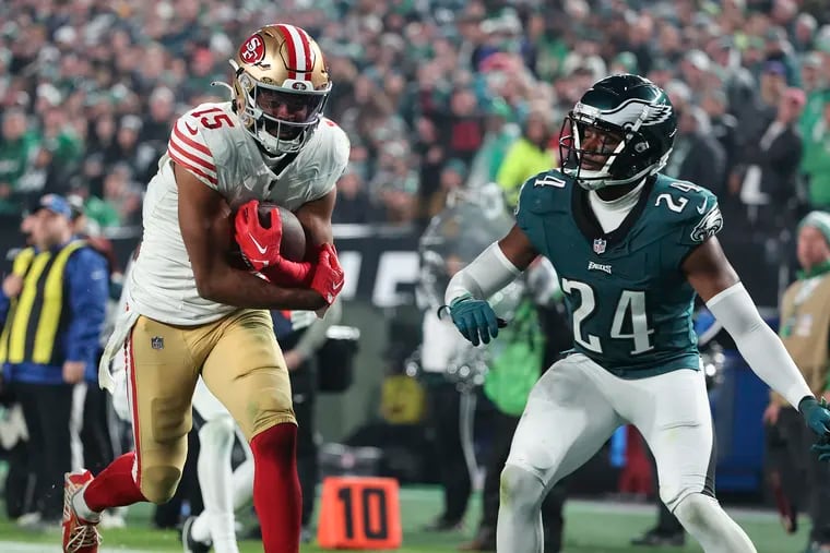 San Francisco 49ers wide receiver Jauan Jennings runs past Eagles cornerback James Bradberry on his way to an 18-yard touchdown in the fourth quarter on Sunday.