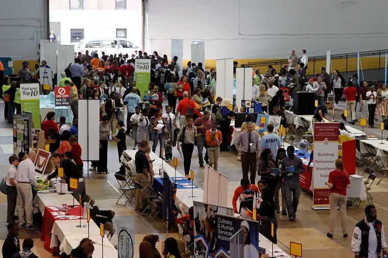 KIds walk into the fair at the Armory at Drexel University on North 33rd Street, between Market and Cuthbert streets. District, charter and private schools were represented, all offering their options amid the great turmoil of the Philadelphia schools financial woes on Friday, October 17, 2014. ( RON CORTES / Staff Photographer )