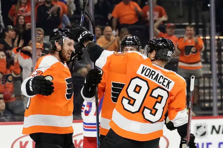 The Flyers' Kevin Hayes (left) celebrating a preseason goal with Oskar Lindblom and Jakub Voracek. Hayes played on a line with Voracek and Claude Giroux in the season-opening win against Chicago in Prague.