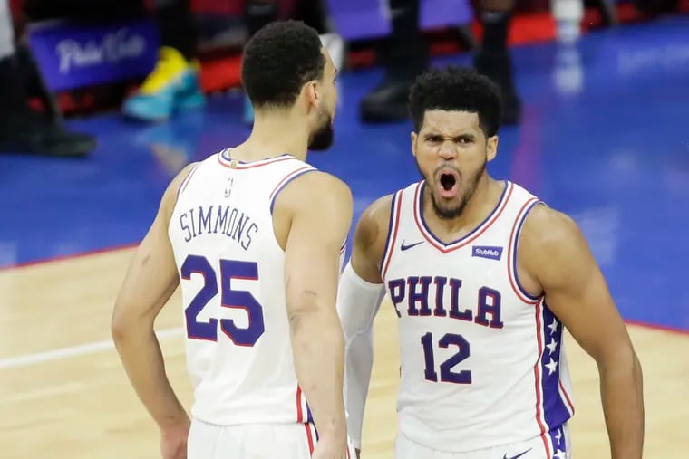 Sixers forward Tobias Harris celebrates with teammate Ben Simmons during Game 7 of the NBA Eastern Conference semifinals on Sunday, June 20, 2021 in Philadelphia.