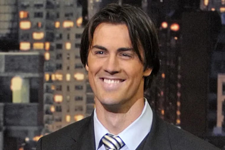 Phillies pitcher Cole Hamels presents the "Top Ten Things That Went Through Cole Hamels' Mind After Winning The World Series," on the set of the Late Show with David Letterman last night. (AP Photo / CBS, Jeffrey R. Staab)