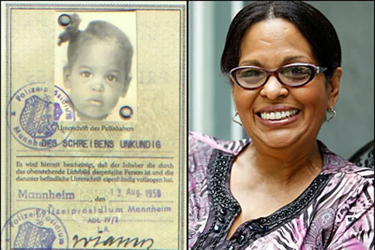 Rosemarie Pena, formerly Wanda Lynn Haymon, heads the Black German Cultural Society of New Jersey. At left is her German passport when she was 2 years old. Pena's biological father is black; her mother a white German national.