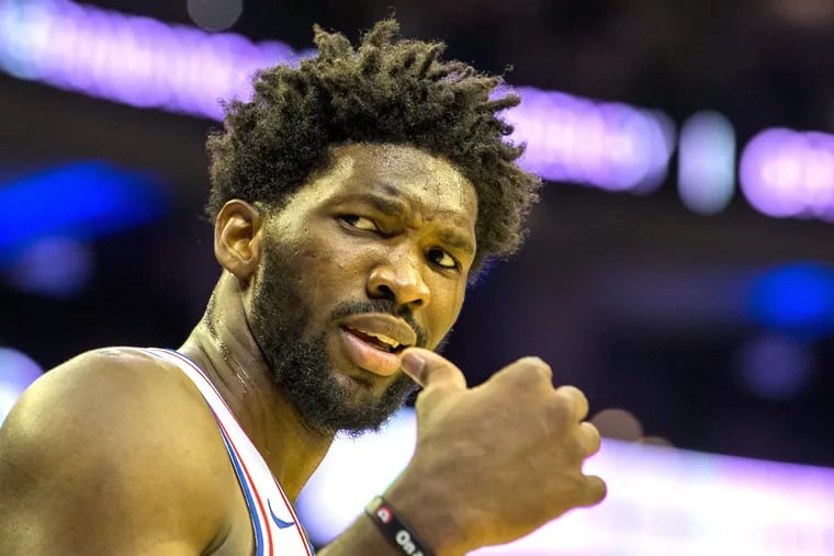 Joel Embiid reacts to an official's call during the preseason game against the Magic.